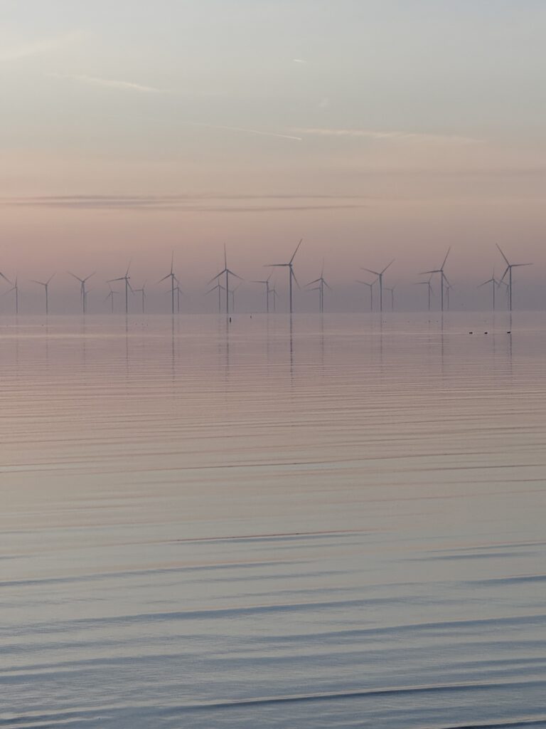 Wind turbines IJsselmeer Friesland misty morning